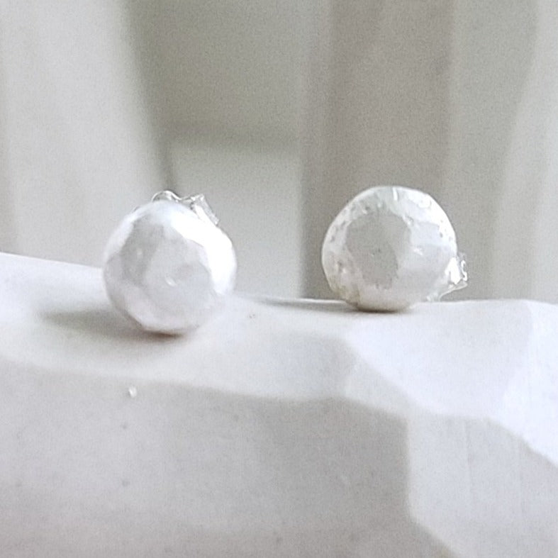 White studs sterling silver earrings, faceted pebbles round